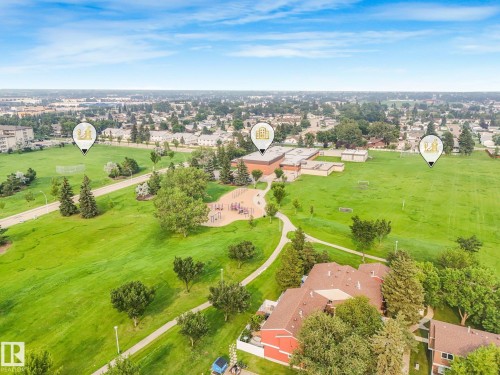 Expansive parkland setting featuring a playground, walking paths, and sports fields - 4135 134 Avenue Nw, Edmonton, AB - Outdoor With View