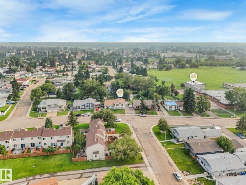 Aerial perspective showcasing a residential neighborhood with a mix of single-family homes and townhomes - 4135 134 Avenue Nw, Edmonton, AB - Outdoor With View