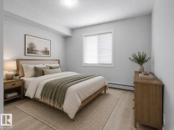 Recessed ceiling lighting, wood-finish flooring, and a large window with white blinds - 
