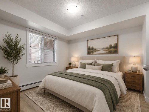 Wood-finish flooring with a neutral color palette - #205 5816 Mullen Pl Nw, Edmonton, AB - Indoor Photo Showing Bedroom