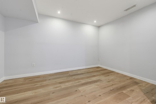 Recessed lighting, light wood-finish flooring, and white walls - 9127 149 Street Nw, Edmonton, AB - Indoor Photo Showing Other Room