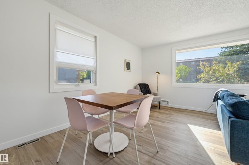 Wood-finish flooring throughout - 9127 149 Street Nw, Edmonton, AB - Indoor Photo Showing Dining Room