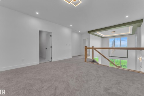 Upper level featuring carpeting, recessed lighting, and a contemporary light fixture - 764 Astoria Way, Devon, AB - Indoor Photo Showing Other Room