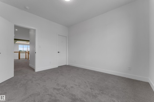 Plush carpeting, white painted walls, and ceiling-mounted lighting - 764 Astoria Way, Devon, AB - Indoor Photo Showing Other Room