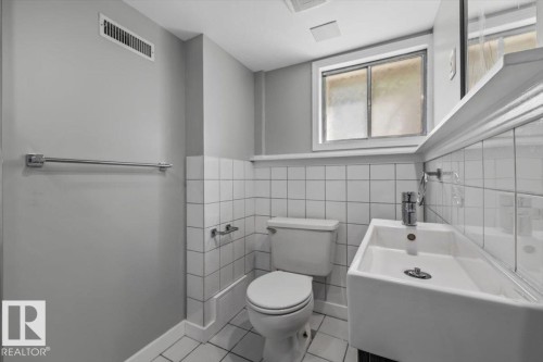 White square tile wainscoting and flooring - 11429 64 Street Nw, Edmonton, AB - Indoor Photo Showing Bathroom