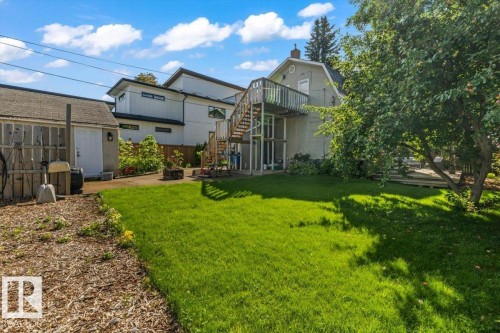 Expansive grassy yard with mature trees - 11429 64 Street Nw, Edmonton, AB - Outdoor