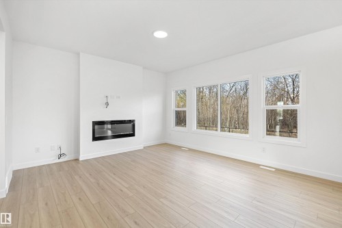 17611 7 Street Ne, Edmonton, AB - Indoor Photo Showing Living Room With Fireplace