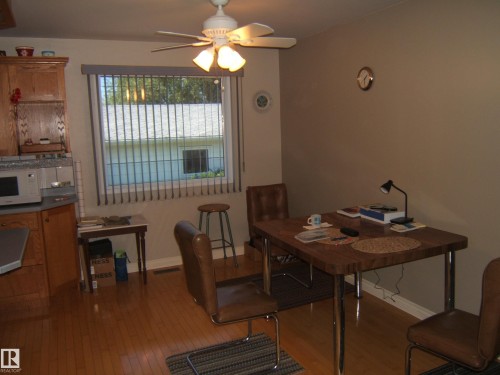 Wood-finish flooring throughout - 5404 49 Street, Two Hills, AB - Indoor