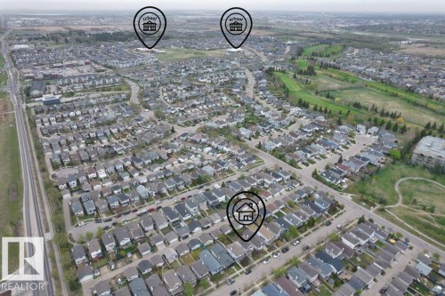Aerial perspective of a residential community featuring established homes, paved streets, and mature landscaping - 21344 88 Avenue Nw, Edmonton, AB - Outdoor With View
