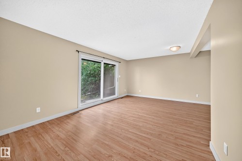 Wood-finish flooring with neutral wall tones - 6416 180 Street Nw, Edmonton, AB 