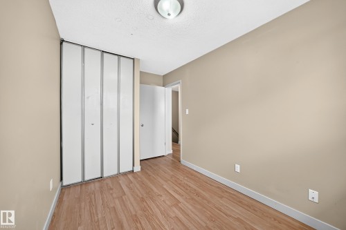 Wood-finish flooring with neutral wall tones - 6416 180 Street Nw, Edmonton, AB 