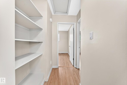 Built-in shelving, wood-finish flooring, and light wall tones - 6416 180 Street Nw, Edmonton, AB 