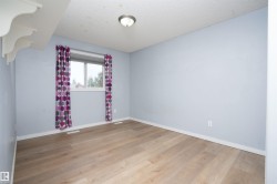 Wood-finish flooring with white trim - 
