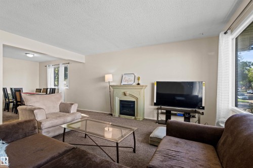11703 38 Street Nw, Edmonton, AB - Indoor Photo Showing Living Room With Fireplace