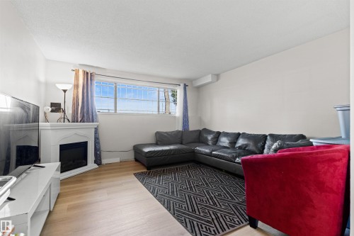 11703 38 Street Nw, Edmonton, AB - Indoor Photo Showing Living Room With Fireplace