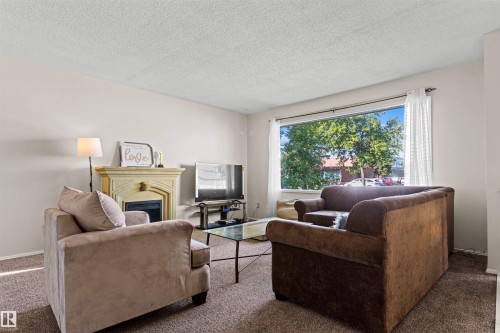 11703 38 Street Nw, Edmonton, AB - Indoor Photo Showing Living Room With Fireplace