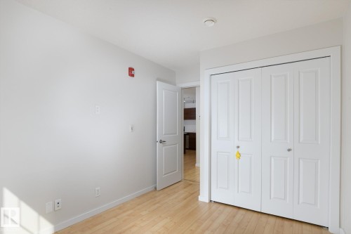 Hardwood flooring with neutral wall tones - #110 9523 160 Av Nw, Edmonton, AB - Indoor