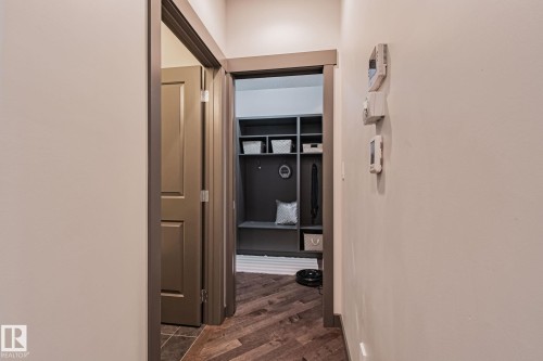 Built-in mudroom storage with integrated bench seating and shelving - 1337 Secord Landing Nw, Edmonton, AB - Indoor Photo Showing Other Room