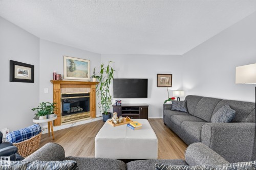 #405 3 Perron St, St. Albert, AB - Indoor Photo Showing Living Room With Fireplace