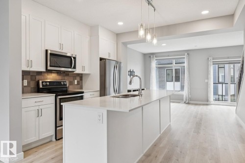 #110 1010 Rabbit Hill Rd Sw Sw, Edmonton, AB - Indoor Photo Showing Kitchen With Stainless Steel Kitchen With Upgraded Kitchen