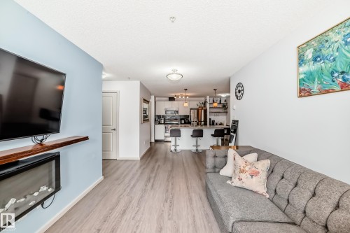 148-348 Windermere Road Nw, Edmonton, AB - Indoor Photo Showing Living Room With Fireplace
