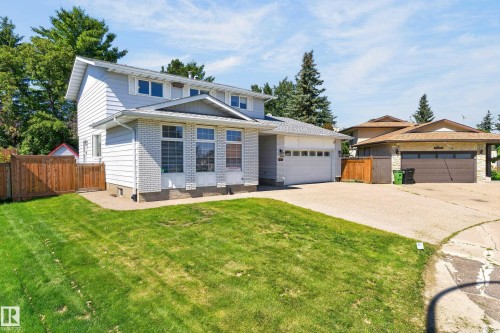 Two-story residence featuring light siding and white brick accents - 8632 184 Street Nw, Edmonton, AB - Outdoor