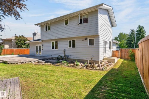 Two-story residence featuring light gray siding, multiple windows, and a back deck area - 8632 184 Street Nw, Edmonton, AB - Outdoor