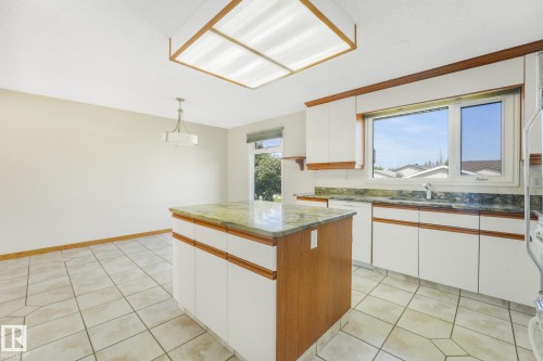 8608 152A Avenue Nw, Edmonton, AB - Indoor Photo Showing Kitchen With Double Sink