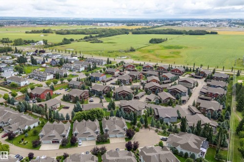 Aerial perspective showcasing a residential community with varied architectural styles - 203 Graybriar Green, Stony Plain, AB - Outdoor With View