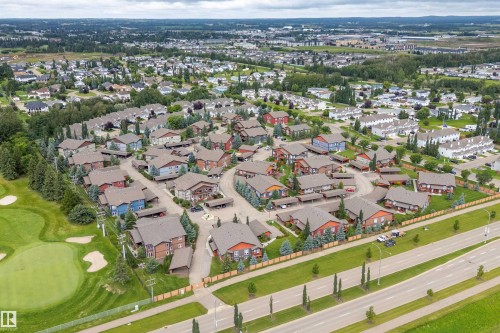 Residential neighborhood with a golf course border, mature trees, and varying architectural styles - 203 Graybriar Green, Stony Plain, AB - Outdoor With View