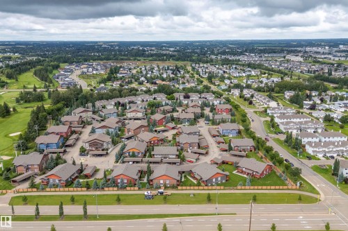 Residential community featuring varied architectural styles and mature landscaping - 203 Graybriar Green, Stony Plain, AB - Outdoor With View