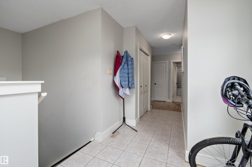 Tile flooring throughout, white trim, and neutral wall tones - 203 Graybriar Green, Stony Plain, AB - Indoor Photo Showing Other Room
