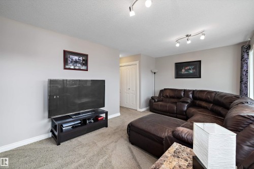 Recessed ceiling lighting, ceiling-mounted track lighting, and light gray wall paint - 3922 Agar Court Sw, Edmonton, AB - Indoor Photo Showing Living Room