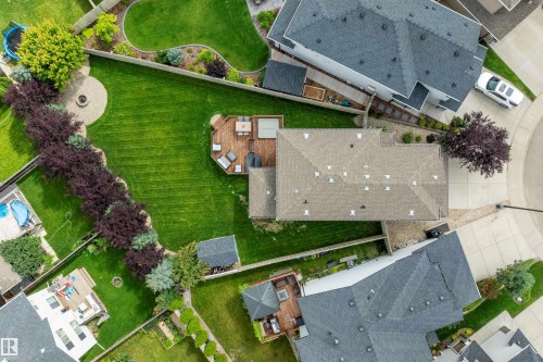 Expansive green lawn with a paver patio and fire pit - 3922 Agar Court Sw, Edmonton, AB - Outdoor With View