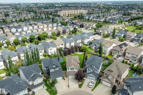 Residential area featuring single-family homes with pitched roofs and attached garages - 3922 Agar Court Sw, Edmonton, AB - Outdoor With View