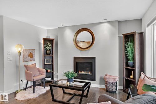 6642 Cardinal Road Sw, Edmonton, AB - Indoor Photo Showing Living Room With Fireplace