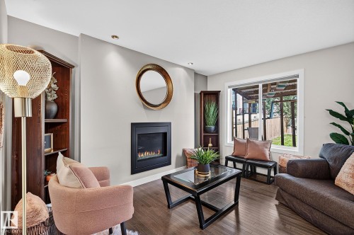 6642 Cardinal Road Sw, Edmonton, AB - Indoor Photo Showing Living Room With Fireplace