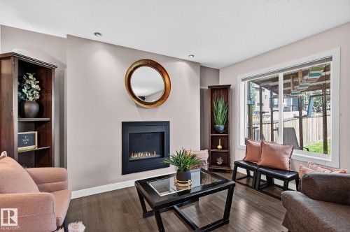 6642 Cardinal Road Sw, Edmonton, AB - Indoor Photo Showing Living Room With Fireplace