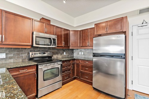 #702 10303 111 St Nw, Edmonton, AB - Indoor Photo Showing Kitchen With Stainless Steel Kitchen