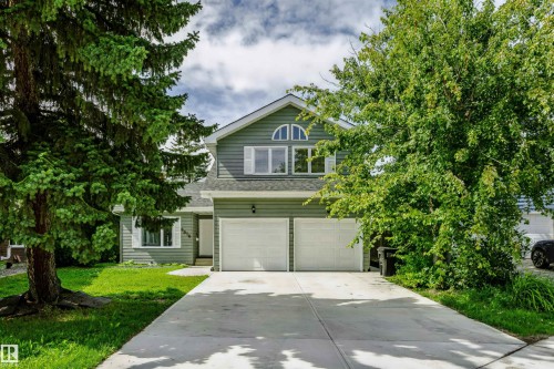 Two-story residence featuring a dual garage and a concrete driveway - 6016 177 Street Nw, Edmonton, AB - Outdoor With Facade