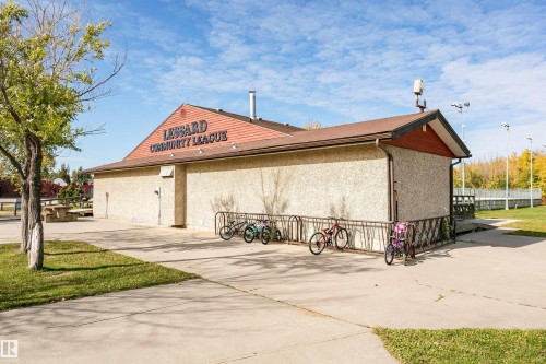 Concrete exterior with a prominent gabled roofline - 6016 177 Street Nw, Edmonton, AB - Outdoor With Exterior