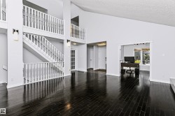 Vaulted ceilings with dark wood-finish flooring - 