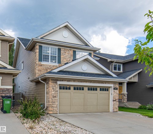 Stone and siding exterior with gabled roofline - 1419 Chahley Place Nw, Edmonton, AB - Outdoor