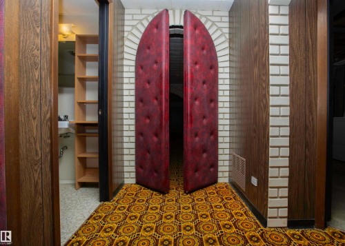 Archway featuring unique padded double doors - 11131 52 Street Nw, Edmonton, AB - Indoor