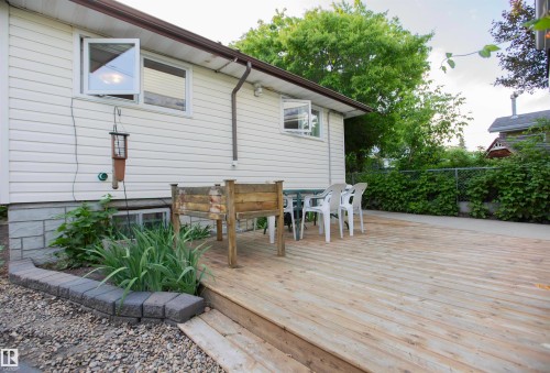 Spacious wood deck with perimeter landscaping - 11131 52 Street Nw, Edmonton, AB - Outdoor With Exterior