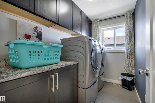 3812 Triomphe Boulevard, Beaumont, AB - Indoor Photo Showing Laundry Room