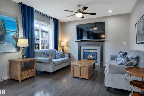 3812 Triomphe Boulevard, Beaumont, AB - Indoor Photo Showing Living Room With Fireplace