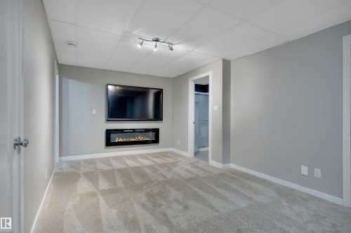 3812 Triomphe Boulevard, Beaumont, AB - Indoor With Fireplace