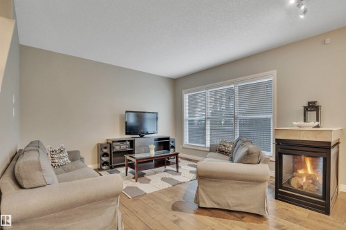 208 Bridgeport Close, Leduc, AB - Indoor Photo Showing Living Room With Fireplace