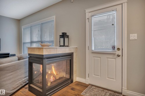 208 Bridgeport Close, Leduc, AB - Indoor Photo Showing Living Room With Fireplace